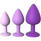 Ensemble de trois plugs anaux en silicone violet (S/M/L) debout, socles sans relief apparent