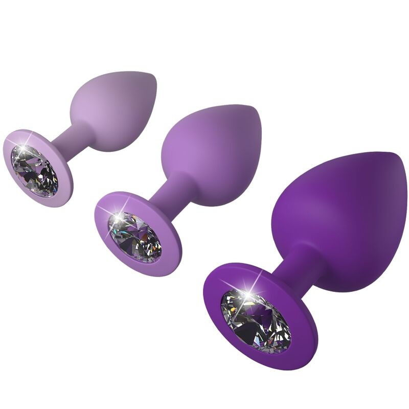 Trois plugs anaux violets alignés en diagonale par taille croissante, strass scintillants à la base