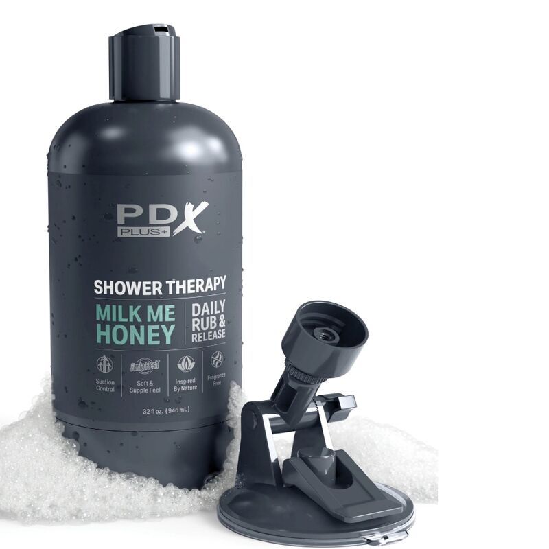 Bouteille PDX Shower Therapy Milk Me Honey posee sur des cristaux avec son support ventouse repliable pour la fixation murale en douche.