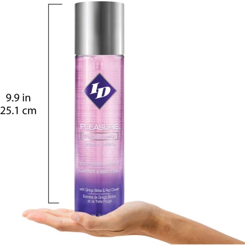 Flacon ID Pleasure pose sur une main paume ouverte, repere d'echelle 25,1 cm, lubrifiant base eau picotement stimulant degrade rose