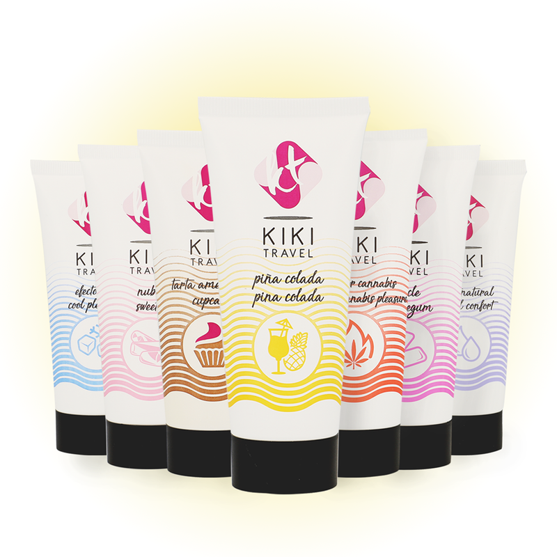 Gamme complete des lubrifiants gourmands Kiki Travel alignes par saveurs colorees, dont le Pina Colada, tous en base eau hydratante vegan sans sucre ni gluten.