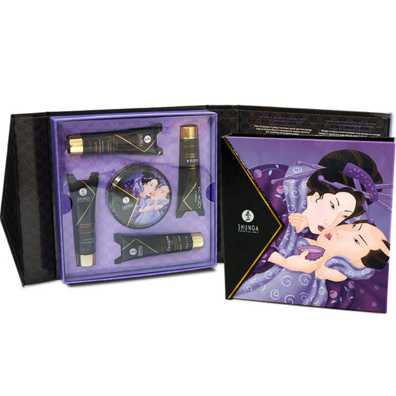 Coffret Shunga ouvert présentant ses flacons et bougie rangés dans l'écrin, à côté de la boîte illustrée d'une geisha, assortiment de cosmétiques sensuels pour couple.