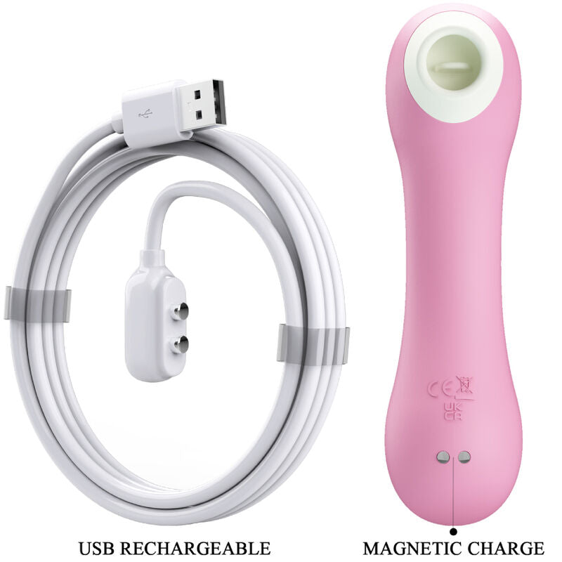 Stimulateur clitoridien a succion rose presenté avec son cable de charge magnetique USB, embout d'aspiration blanc, silicone, mention recharge magnetique