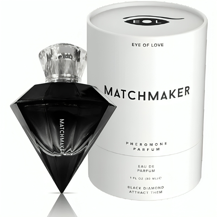 Parfum aux phéromones mixte Matchmaker Black Diamond, flacon diamant noir posé devant son etui blanc, eau de parfum boisee aux notes de cedre et cassis, 30 ml.