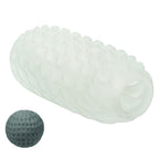 Masturbateur Boundless CalExotics translucide texture de vaguelettes pose pres de sa balle de tension grise amovible, stroker reversible souple a double sensation manuelle