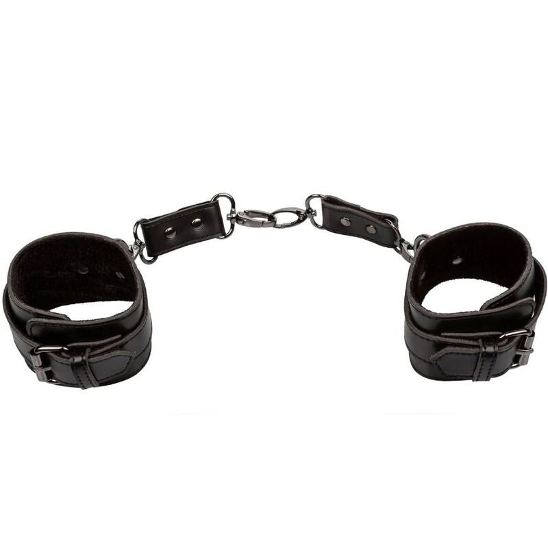 Manchettes de cheville Euphoria noires posées à plat, reliées par une chaîne centrale à trois maillons rivetés.