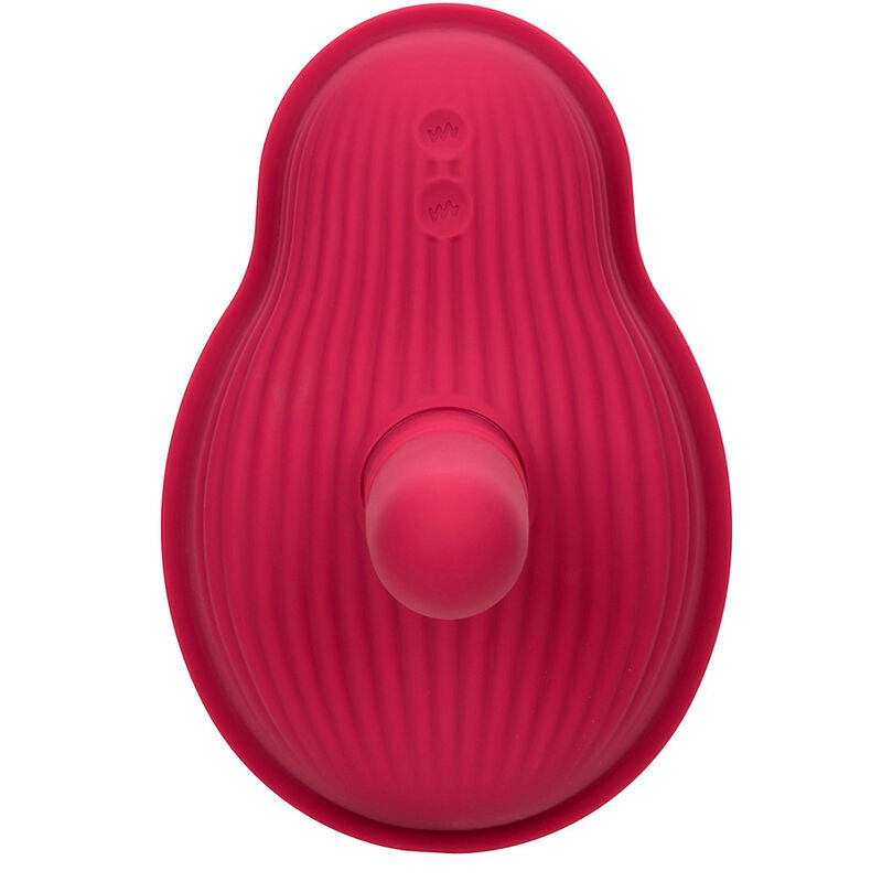 Dessous du Rider Massager, bouton marche/arrêt central, prise DC et marquages de conformité UKCA CE gravés.