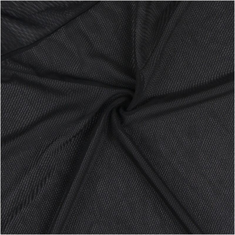 Gros plan macro sur la maille résille noire de la jupe du babydoll Subblime, texture transparente extensible, détail matière de la nuisette vaporeuse