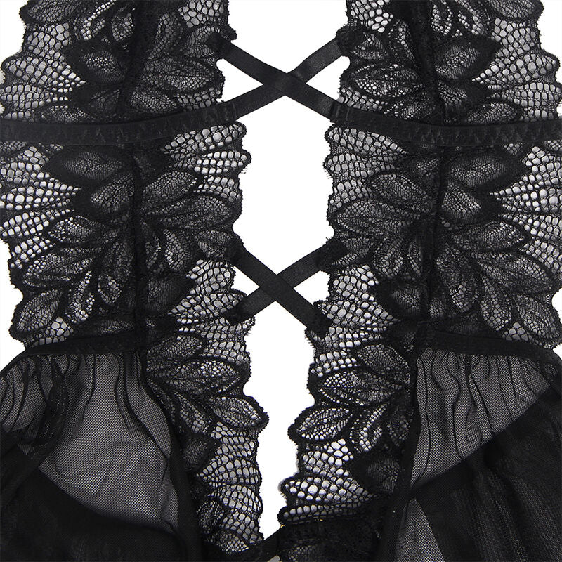 Gros plan sur la dentelle à motif plumes et le laçage croisé du teddy noir Subblime, détail broderie et tulle de la lingerie sensuelle