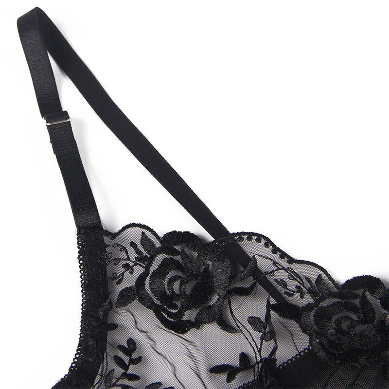 Gros plan du soutien-gorge noir Subblime : bretelle, armature et dentelle transparente brodee de roses, presentation produit a plat sur fond blanc.