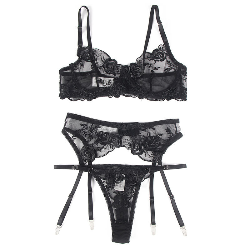 Ensemble lingerie noir Subblime a plat : soutien-gorge dentelle a armatures, porte-jarretelles et string assortis, presentation produit sur fond blanc.