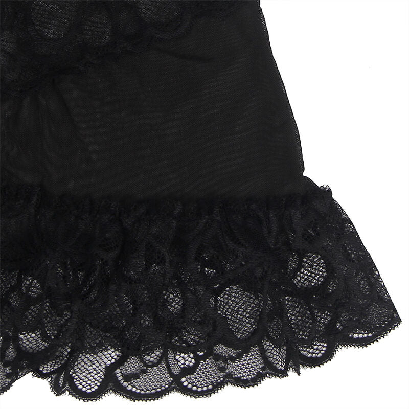 Gros plan du volant inferieur en dentelle festonnee du babydoll noir Subblime, motifs floraux ajoures, detail produit pose a plat sur fond blanc.