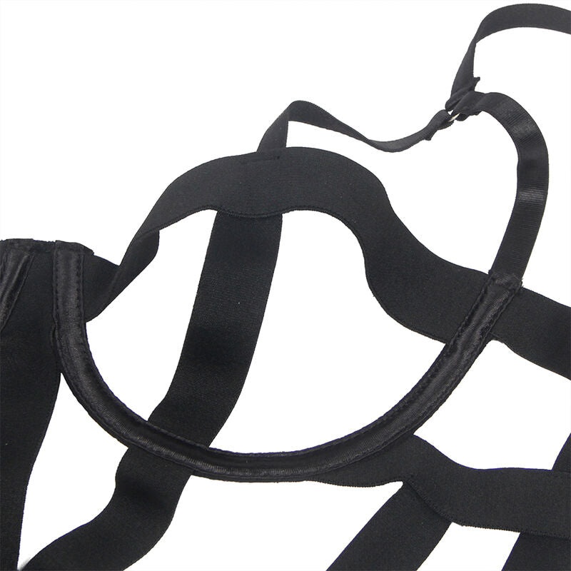 Gros plan des bretelles et sangles elastiques noires du body strappy Subblime, jonctions et croisements des bandes mates extensibles, detail de l assemblage sans modele.
