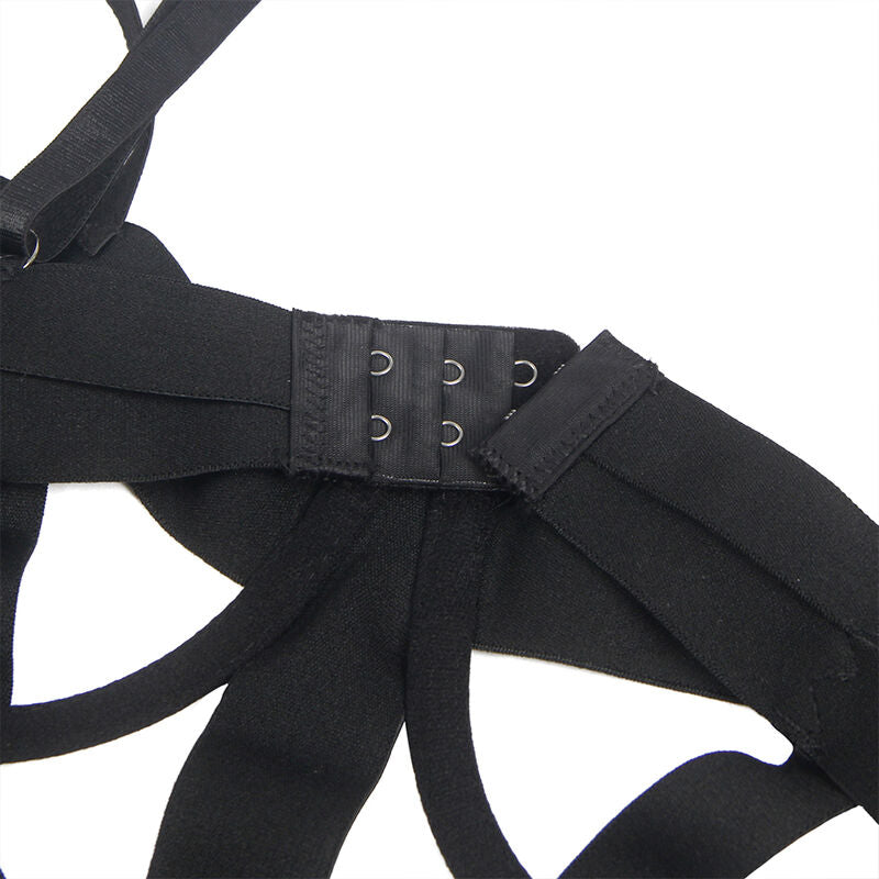 Detail de la fermeture a crochets du body cage noir Subblime, rangee d agrafes reglables sur large bande elastique mate, gros plan du systeme de fermeture, presentation produit sans corps.