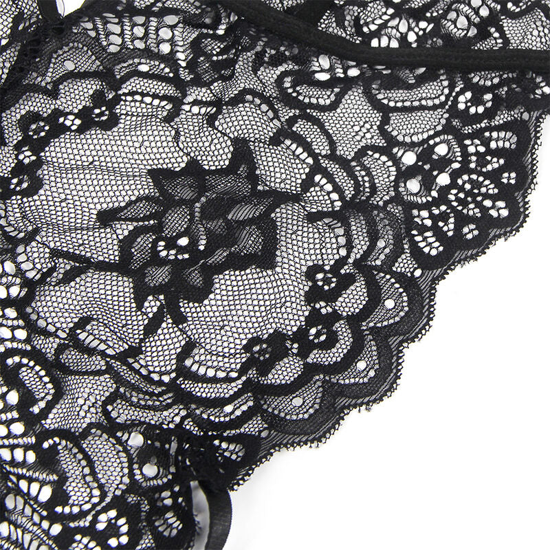 Detail du motif floral de la dentelle noire du body police Subblime, finition ajouree illustrant la finesse du tissu.