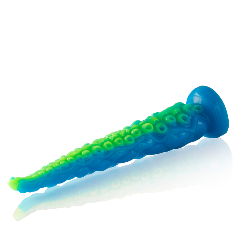Gode tentacule fin fluorescent bleu et vert presente a l'horizontale, longueur effilee et base ventouse, texture de ventouses fantasy en silicone souple phosphorescent