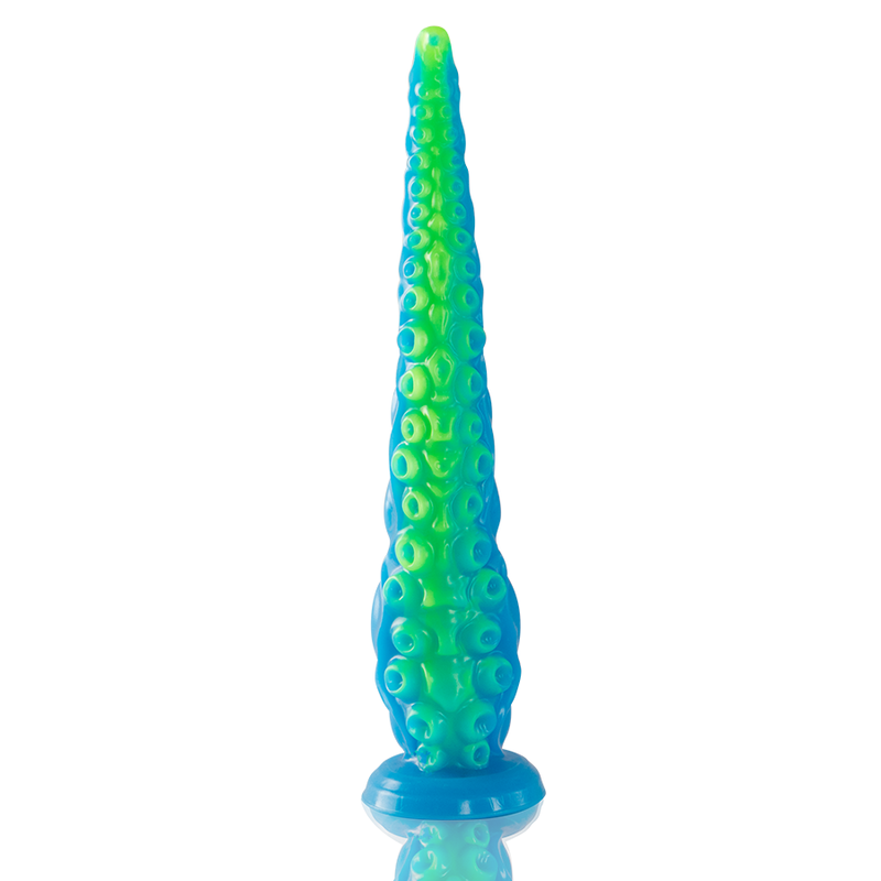 Gode tentacule fin fluorescent en silicone bleu et vert vu de face, pointe effilee et base ventouse evasee, alignement de ventouses pour une stimulation graduelle