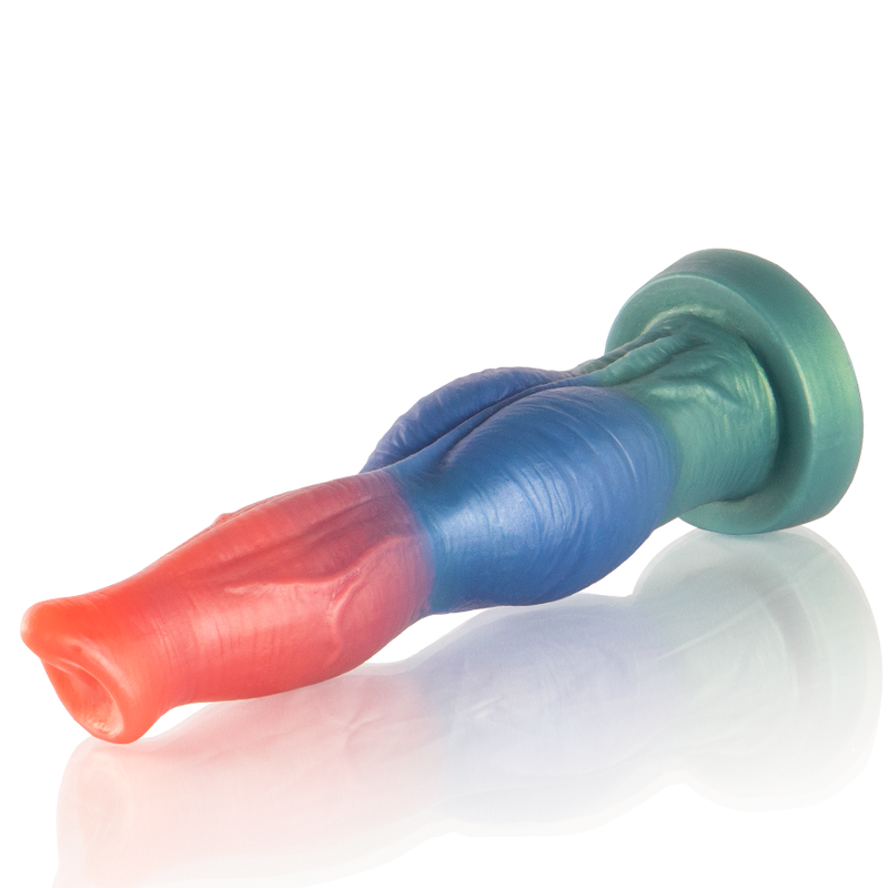 Gode Arion en silicone degrade corail et bleu couche de trois quarts, base ventouse verte. Fut texture aux teintes vives, matiere souple flexible pour une exploration progressive.
