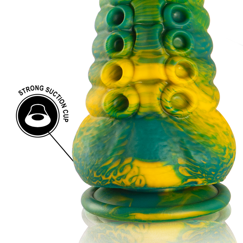 Detail de la base bulbeuse vert et jaune du gode tentacule, ventouses sculptees et pictogramme strong suction cup, silicone souple pour un maintien stable.