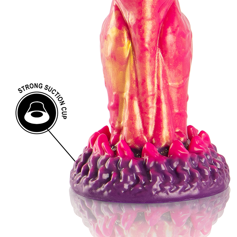 Gode Cerberus silicone rose et orange, gros plan sur base sculptee compatible harnais, gland marque et double epaississement texture aux teintes de feu.
