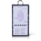 Dos de boîte Mimi Deux avec schéma annoté du galet lilas texturé et ses légendes, rangée de pictogrammes de fonctions alignés en bas du packaging sur fond de plume clair épuré.