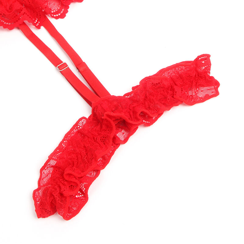 Vue rapprochée de la jarretière en dentelle rouge à volant du teddy Subblime, montrant l'anneau de jambe métallique et la finesse délicate de la maille florale transparente.