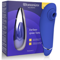 Boîte bleu nuit du Womanizer Premium 2 et stimulateur clitoridien bleu au liseré argenté, embout d'aspiration en silicone, technologie Pleasure Air sans contact.
