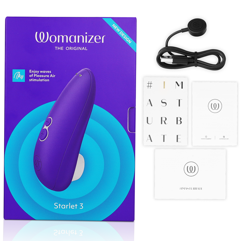 Boîte violette et bleue du Starlet 3, câble de charge et cartes de notice à côté, stimulateur clitoridien Womanizer violet par aspiration d'air. Présentation complète du coffret cadeau.