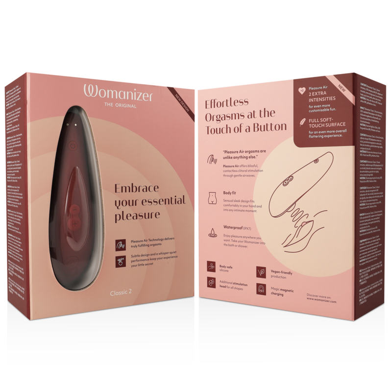 Emballage rose du Womanizer Classic 2 ouvert montrant les arguments produit et un schéma d'usage du stimulateur clitoridien par aspiration, sans anatomie.