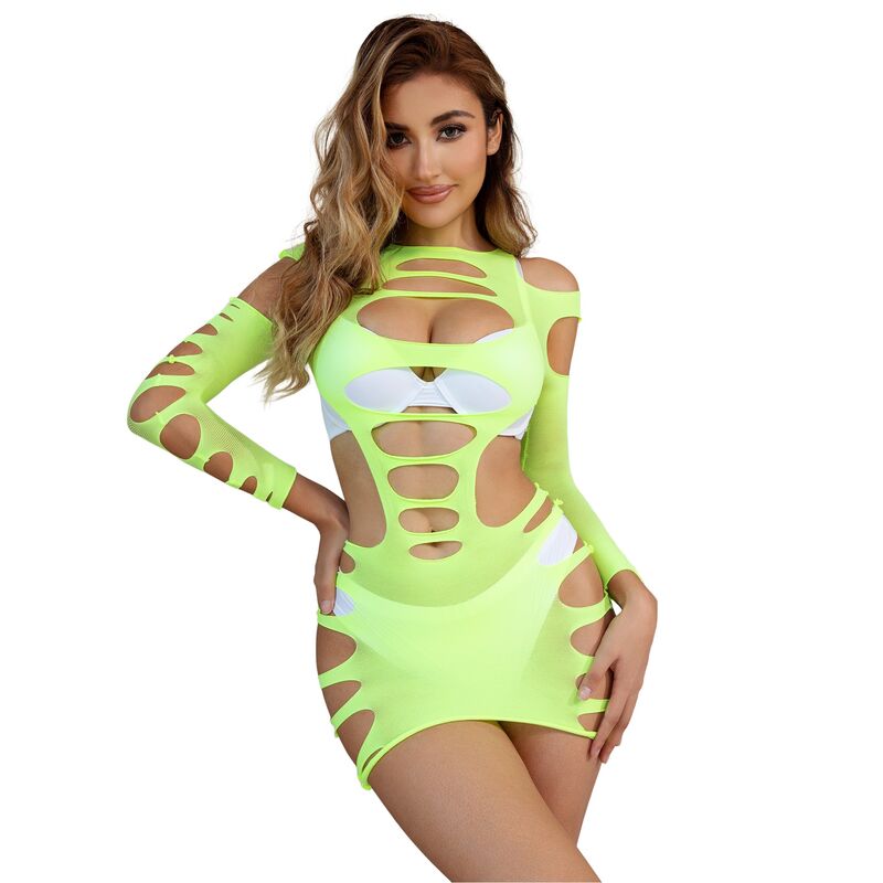 Robe resille rose fluo Subblime a manches longues portee debout, decoupes ajourees sur la poitrine et le ventre laissant transparaitre la peau, ambiance chambre claire.