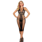 Modele en nuisette resille noire col licou Subblime, larges mailles transparentes revelant poitrine et hanches nues, pose de face mains aux hanches en interieur clair.