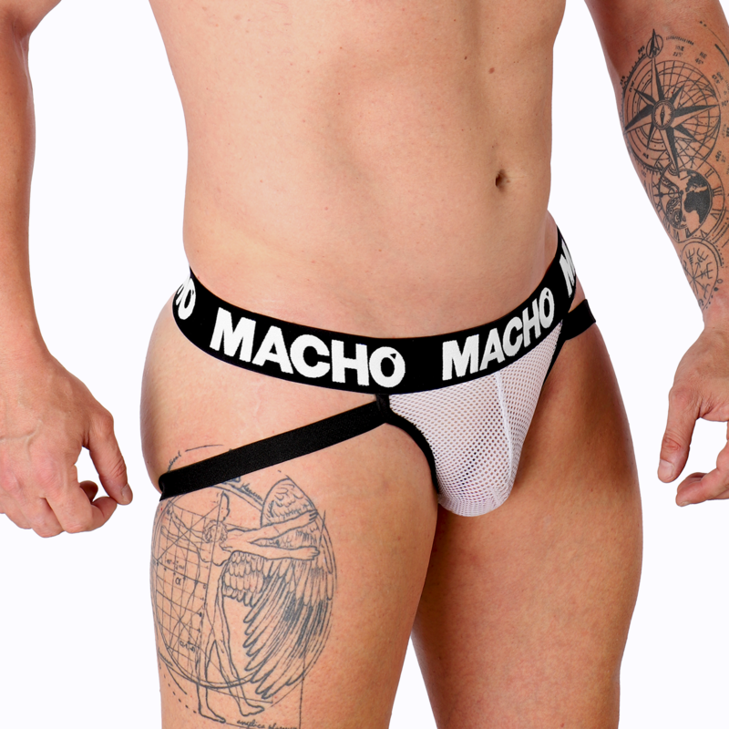 Jockstrap homme blanc semi-transparent MX26X1 vu de profil, maille grid transparente pochette de maintien lanieres logo Macho hanche nue tatouee, contraste sensuel