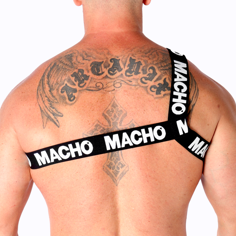 Harnais homme Macho à sangles jaunes vu de dos sur dos tatoué musclé, bandes logo sur les épaules, affirmant un look fétichiste coloré et un maintien structurant près du corps.