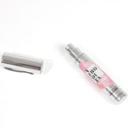 Flacon stylo Afrodita For Women ouvert, capuchon argente pose a cote, spray parfum feminin aux pheromones Secret Play, format 9,5 ml pratique a emporter.