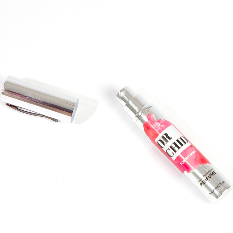 Flacon stylo Orchid For Women ouvert, capuchon argente pose a cote, spray parfum feminin aux pheromones Secret Play au format nomade facile a emporter.
