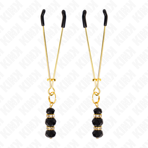 Pinces a tetons fines dorees a billes de verre noir, presentees verticalement sur fond blanc. Accessoire BDSM de 7 cm au pincement leger et reglable pour stimulation.