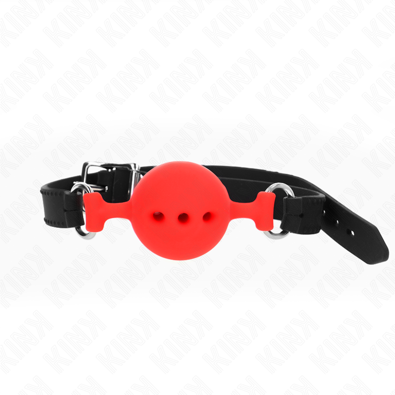 Baillon boule rouge en silicone ajoure sur sangle noire a anneaux argentes, boule percee dans une teinte vive pour pimenter le jeu de soumission