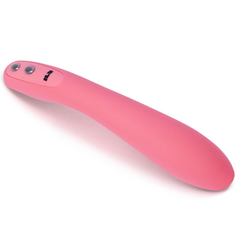Gros plan sur la tête arrondie du wand point G rose, deux boutons argentés et logo gravé, courbe douce de la tige en silicone détaillée de près sur fond blanc parfaitement épuré.