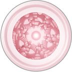 Vue plongeante de l'interieur rose du masturbateur oeuf, tunnel a relief stimulant rayonnant en TPR souple pour des sensations variees.
