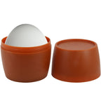 Masturbateur oeuf blanc loge dans son etui terracotta ouvert en deux parties, gaine souple extensible en TPR au format nomade discret.