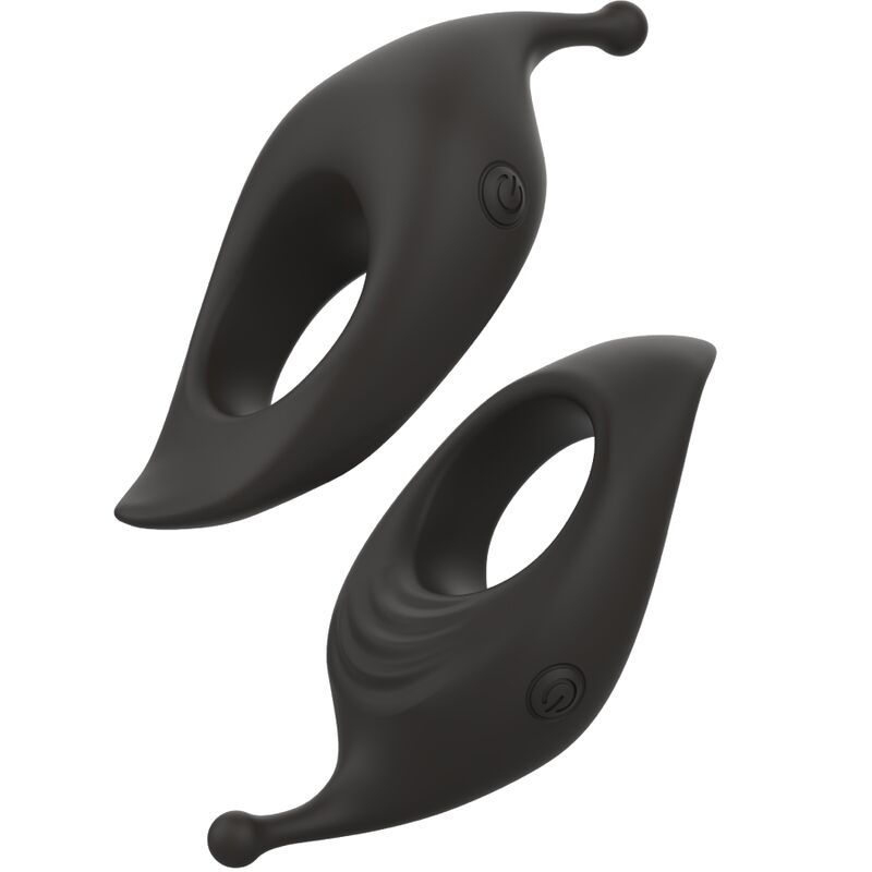 Deux anneaux péniens vibrants noirs présentés sous angles croisés, boucles ouvertes et ergots moteurs. Composition dynamique mettant en avant le design profilé en silicone.