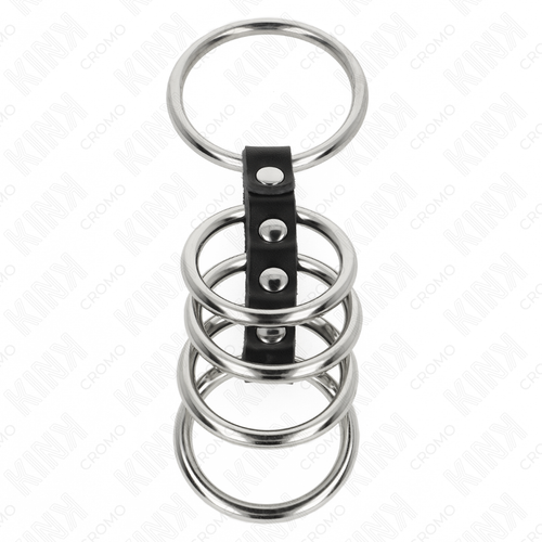 Cage penienne a anneaux d'acier superposes sur sangle cuir a pressions, accessoire cockring etage BDSM masculin presente seul