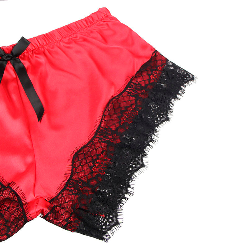 Detail du short satin corail a bord dentelle festonnee noire Subblime, gros plan sur le noeud et la matiere satinee de la parure deux pieces.