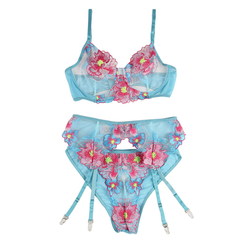 Photo produit a plat de l'ensemble turquoise Subblime, soutien-gorge a broderie florale rose et culotte porte-jarretelles assortie disposes sur un fond blanc neutre.