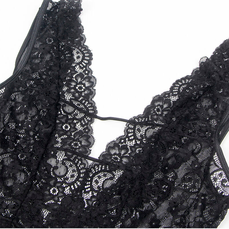 Detail de la dentelle florale ajouree du teddy Subblime, gros plan sur les motifs et la transparence de la maille noire.