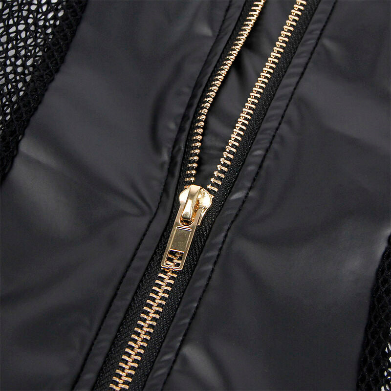 Gros plan sur le zip dore et le contraste wetlook noir et mesh de la nuisette Subblime, curseur metallique et coutures vus de pres sur fond blanc.
