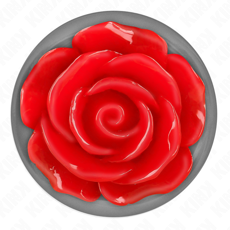 Vue de dessus du socle argente d'un plug anal, rose rouge sculptee en relief au centre d'une base chromee, detail decoratif du bijou anal