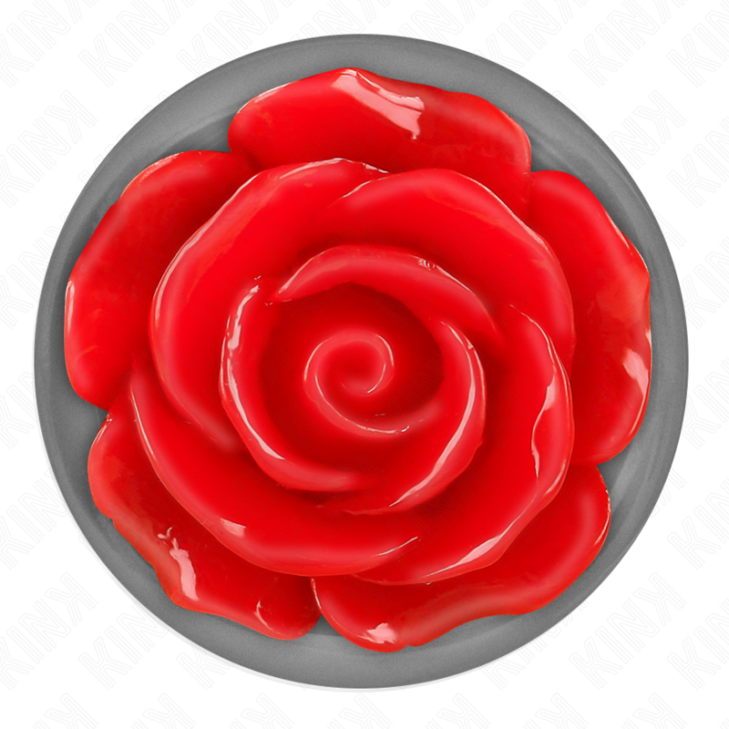 Vue de dessus du socle argente d'un plug anal, large rose rouge sculptee en relief sur base chromee, detail decoratif du grand bijou anal