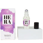 Huile de parfum Hera For Women aux pheromones, boite mauve et flacon roll-on 20 ml capuchon a cote, fragrance feminine Secret Play a bille pour la peau.