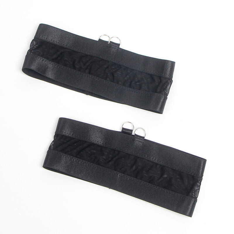 Bandes de cuisse satin noires du porte-jarretelles Subblime posees a plat, finition elastique et anneaux metal, detail accessoire lingerie vue produit.
